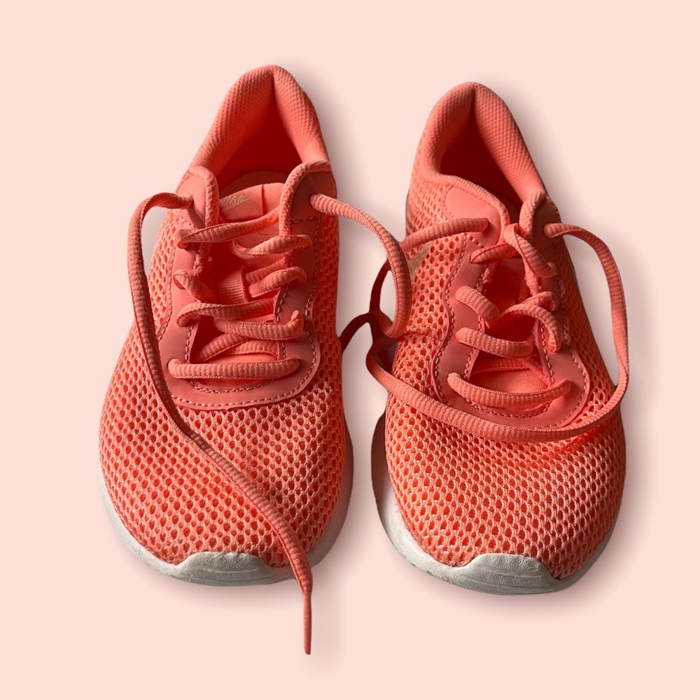 Pink/coral colored running sneakers